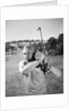 1960s Man Playing Golf Hitting Golf Ball From Fairway With Iron Club by Anonymous