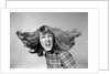 1960s Angry Woman Yelling Gnashing Teeth Hair Flying Looking At Camera by Anonymous
