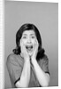 1960s Brunette Woman Screaming Mouth Wide Open Hands To Face Facial Expression Fear Scream Surprise Character Funny Face by Anonymous
