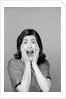 1960s Brunette Woman Screaming Mouth Wide Open Hands To Face Facial Expression Fear Scream Surprise Character Funny Face by Anonymous