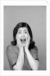 1960s Brunette Woman Screaming Mouth Wide Open Hands To Face Facial Expression Fear Scream Surprise Character Funny Face by Anonymous