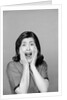 1960s Brunette Woman Screaming Mouth Wide Open Hands To Face Facial Expression Fear Scream Surprise Character Funny Face by Anonymous