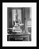 1920s 1930s Senior Woman Grandmother Wearing Apron Crimping Crust Making A Cherry Pie In Kitchen by Anonymous