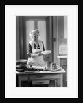 1920s 1930s Senior Woman Grandmother Wearing Apron Crimping Crust Making A Cherry Pie In Kitchen by Anonymous