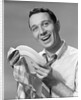 1950s Smiling Man Drying Plate With Dish Towel Looking At Camera by Anonymous