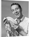 1950s Smiling Man Drying Plate With Dish Towel Looking At Camera by Anonymous