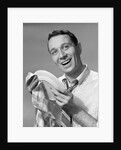 1950s Smiling Man Drying Plate With Dish Towel Looking At Camera by Anonymous