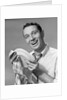 1950s Smiling Man Drying Plate With Dish Towel Looking At Camera by Anonymous