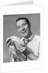1950s Smiling Man Drying Plate With Dish Towel Looking At Camera by Anonymous