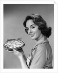 1950s 1960s Smiling Woman Holding Freshly Baked Pie Looking At Camera by Anonymous