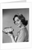 1950s 1960s Smiling Woman Holding Freshly Baked Pie Looking At Camera by Anonymous
