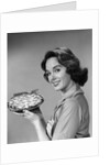 1950s 1960s Smiling Woman Holding Freshly Baked Pie Looking At Camera by Anonymous