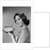 1950s 1960s Smiling Woman Holding Freshly Baked Pie Looking At Camera by Anonymous