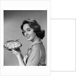 1950s 1960s Smiling Woman Holding Freshly Baked Pie Looking At Camera by Anonymous
