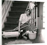 1960s 1970s Exhausted Housewife Sitting At Bottom Of Stairs Surrounded By House Cleaning Equipment by Anonymous