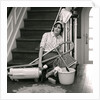 1960s 1970s Exhausted Housewife Sitting At Bottom Of Stairs Surrounded By House Cleaning Equipment by Anonymous
