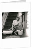 1960s 1970s Exhausted Housewife Sitting At Bottom Of Stairs Surrounded By House Cleaning Equipment by Anonymous