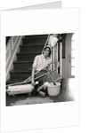 1960s 1970s Exhausted Housewife Sitting At Bottom Of Stairs Surrounded By House Cleaning Equipment by Anonymous