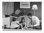 1950s Family Of 4 Gathered In Living Room Playing With Letter Blocks by Anonymous