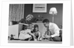 1950s Family Of 4 Gathered In Living Room Playing With Letter Blocks by Anonymous