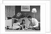 1950s Family Of 4 Gathered In Living Room Playing With Letter Blocks by Anonymous