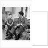 1960s Boy Sitting On Couch Smiling Laughing Talking With Dad by Anonymous