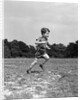 1940s Little Boy Running Playing On Grassy Field by Anonymous