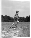 1940s Little Boy Running Playing On Grassy Field by Anonymous