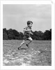 1940s Little Boy Running Playing On Grassy Field by Anonymous