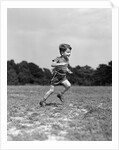 1940s Little Boy Running Playing On Grassy Field by Anonymous