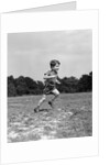 1940s Little Boy Running Playing On Grassy Field by Anonymous