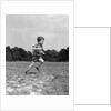 1940s Little Boy Running Playing On Grassy Field by Anonymous