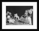 1930s Enthusiastic Little Girl Big Bow Ribbon In Her Hair Singing To Assembled Group Of Dolls Toys And Stuffed Animals by Anonymous