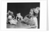 1930s Enthusiastic Little Girl Big Bow Ribbon In Her Hair Singing To Assembled Group Of Dolls Toys And Stuffed Animals by Anonymous