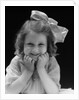 1930s Portrait Smiling Brunette Girl With Big Ribbon Bow In Her Hair Looking At Camera by Anonymous