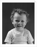 1940s Curly Haired Little Boy Portrait Smiling Looking At Camera by Anonymous