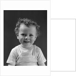 1940s Curly Haired Little Boy Portrait Smiling Looking At Camera by Anonymous