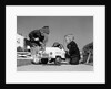 1950s Boy And Girl Playing At Repairing Toy Car by Anonymous