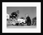 1950s Boy And Girl Playing At Repairing Toy Car by Anonymous