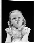 1940s Portrait Of Girl Sticking Out Tongue Wrinkled Up Nose by Anonymous