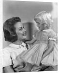 1960s Mother Holding Little Blond Girl Wearing Fancy Dress In Her Arms Looking At Each Other by Anonymous