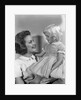 1960s Mother Holding Little Blond Girl Wearing Fancy Dress In Her Arms Looking At Each Other by Anonymous