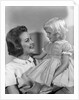 1960s Mother Holding Little Blond Girl Wearing Fancy Dress In Her Arms Looking At Each Other by Anonymous