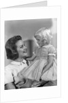 1960s Mother Holding Little Blond Girl Wearing Fancy Dress In Her Arms Looking At Each Other by Anonymous