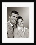 1950s Studio Portrait Smiling Man Father And Boy Son Sitting Together Looking At Camera by Anonymous