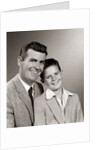 1950s Studio Portrait Smiling Man Father And Boy Son Sitting Together Looking At Camera by Anonymous