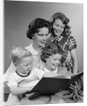 1950s Portrait Mother Two Daughters And Son Reading Book Together by Anonymous