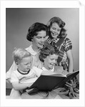1950s Portrait Mother Two Daughters And Son Reading Book Together by Anonymous