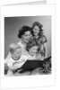 1950s Portrait Mother Two Daughters And Son Reading Book Together by Anonymous