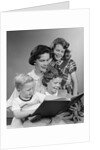 1950s Portrait Mother Two Daughters And Son Reading Book Together by Anonymous